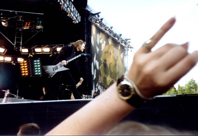 James 'Jaymz' Hetfield giving low-five to audience member